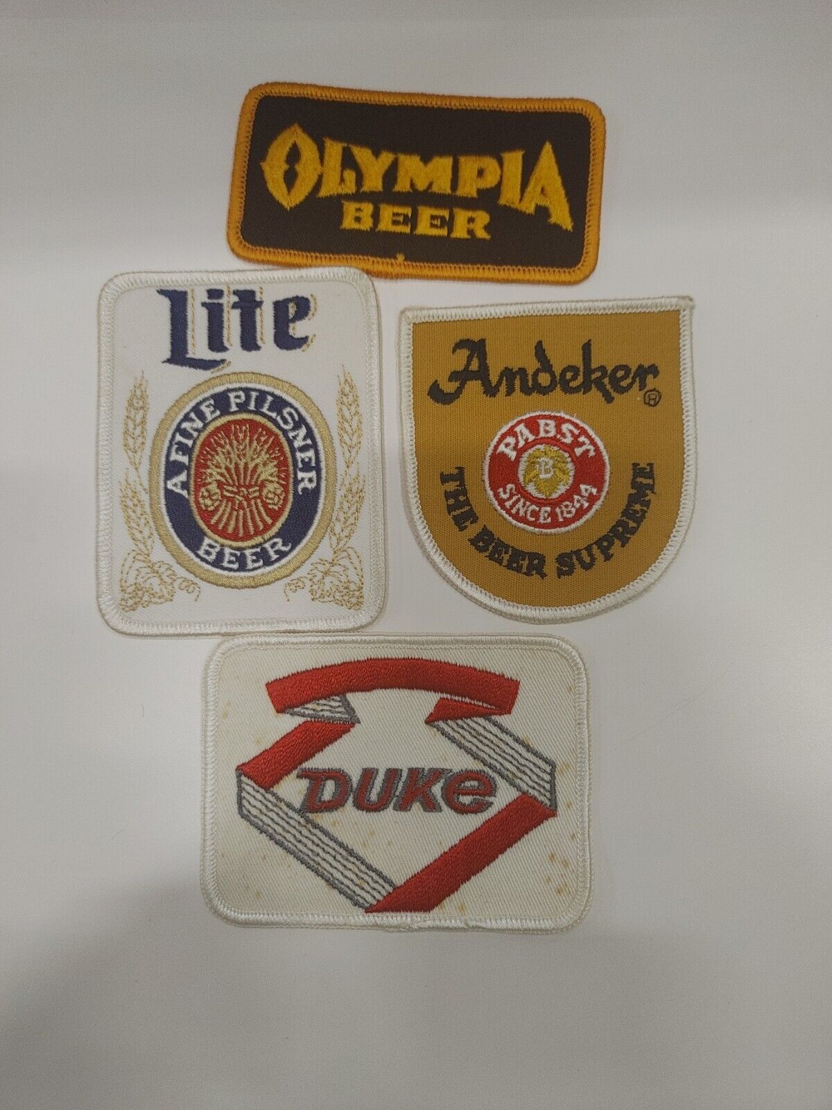 Lot of 4 Beer Patches Rare Andeker& Olympia. Duke MillerLight Duke has rust spot